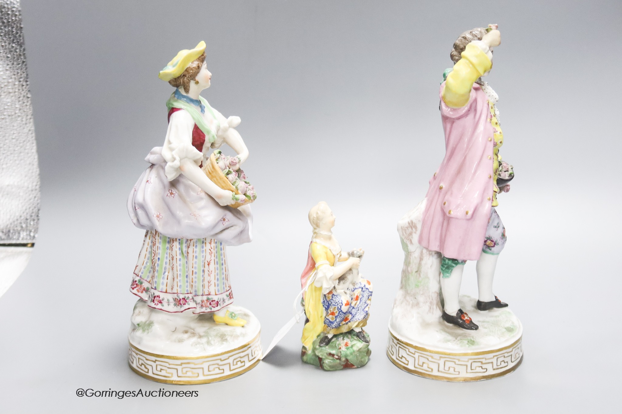 A pair of Continental porcelain figures and smaller, English figure